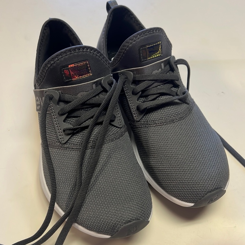 New Balance tennis shoes worn once in house